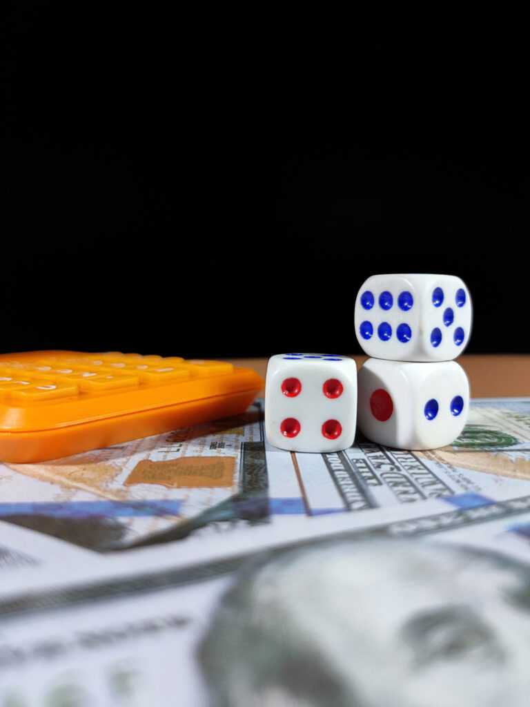 selective-focus-of-a-banknote-dice-and-calculator-2024-12-07-23-53-11-utc